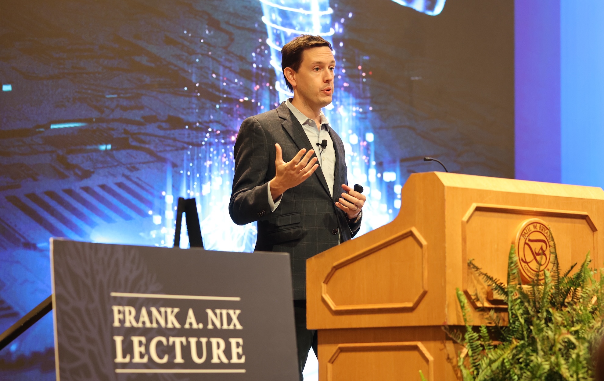 Joshua Jones speaking on stage